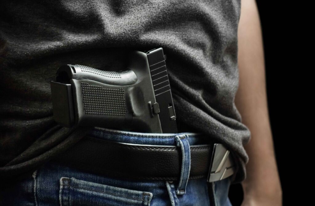 man with gun in pants waist