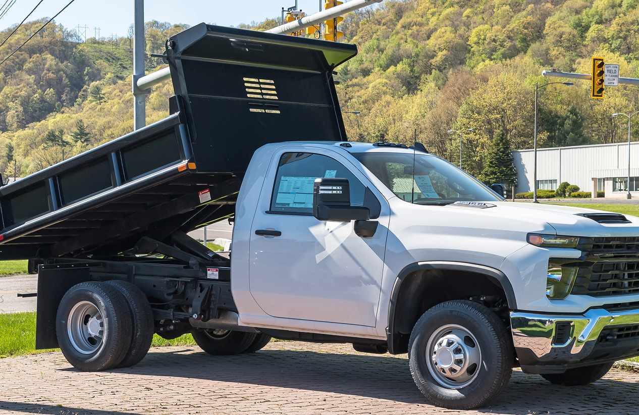 white truck with large bed used for construction