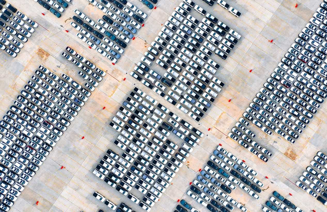 aerial view of cars parked in a large lot