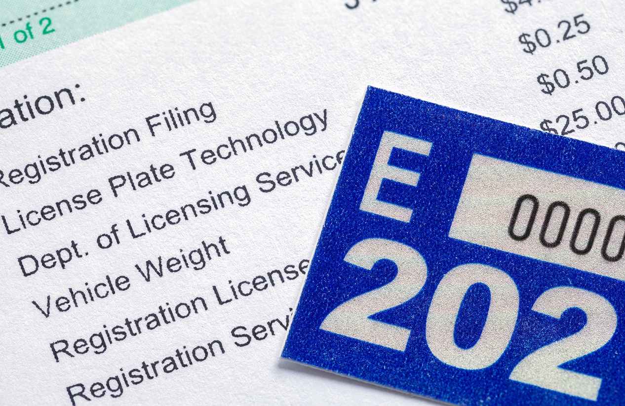cropped in close up of vehicle registration and sticker