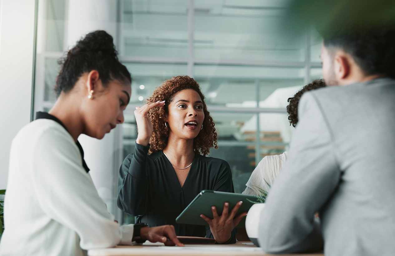 three people collaborating in an office environment