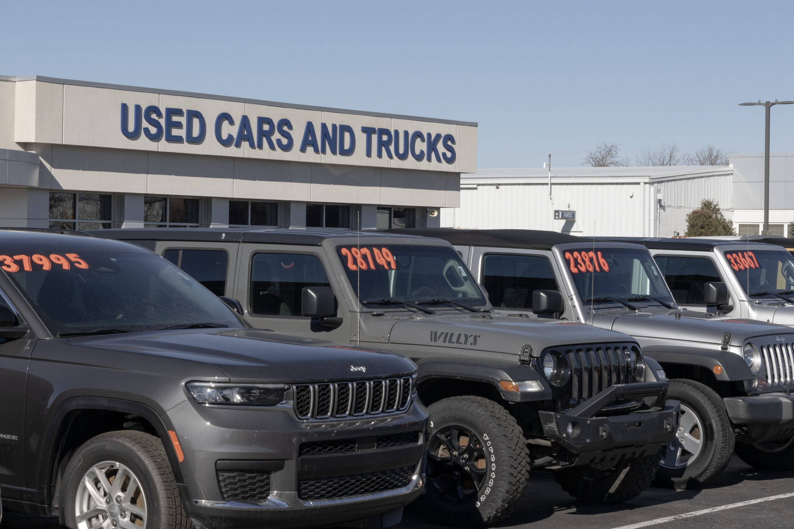 used car lot with Jeep trucks