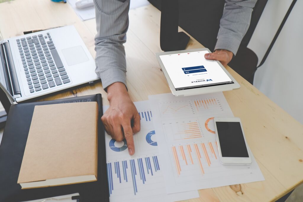 Image of man looking charts and graphs