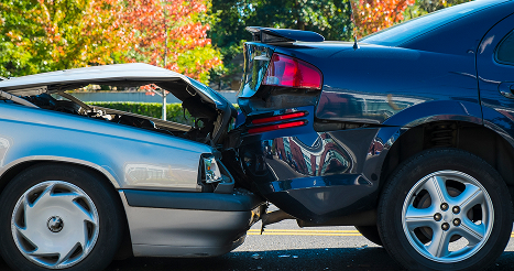Auto accident involving two cars on a city street