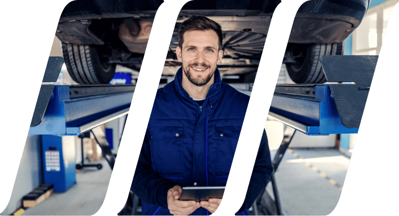 Technical inspection of cars and tablets. Man in uniform holds a tablet in his hands in the workshop canal in front of a car on a hydraulic elevator Portrait of a man at work in a workshop Car service