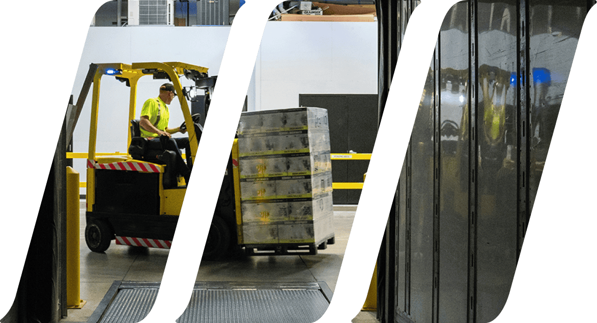 worker moving cargo with mini forklift