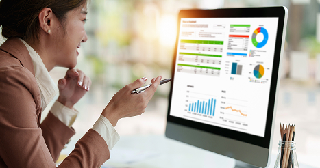 business woman reviewing dashboard on computer screen