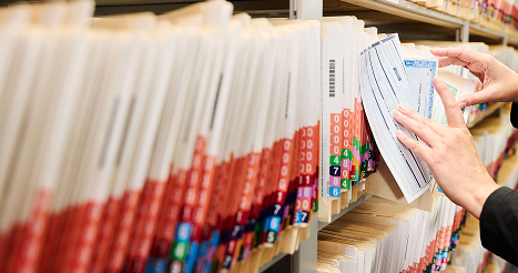 vehicle registration files in a large filling cabinet