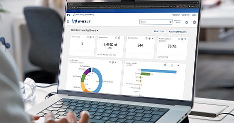 image of a laptop with the wheels fleet overview dashboard visible on the screen