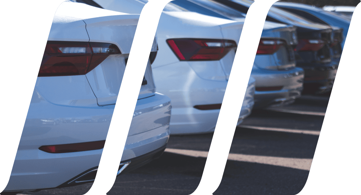 image showing the trucks of several cars parked in a row