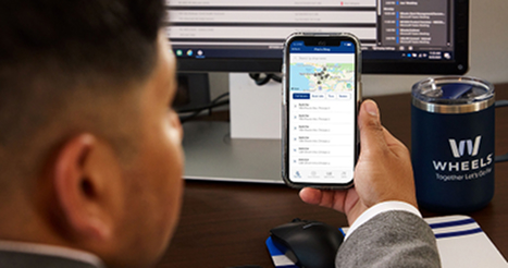 Wheels employee using mobile app