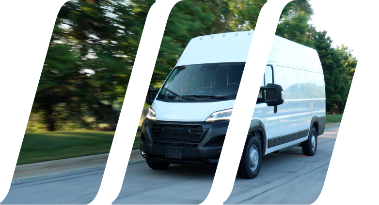 white cargo van driving down road